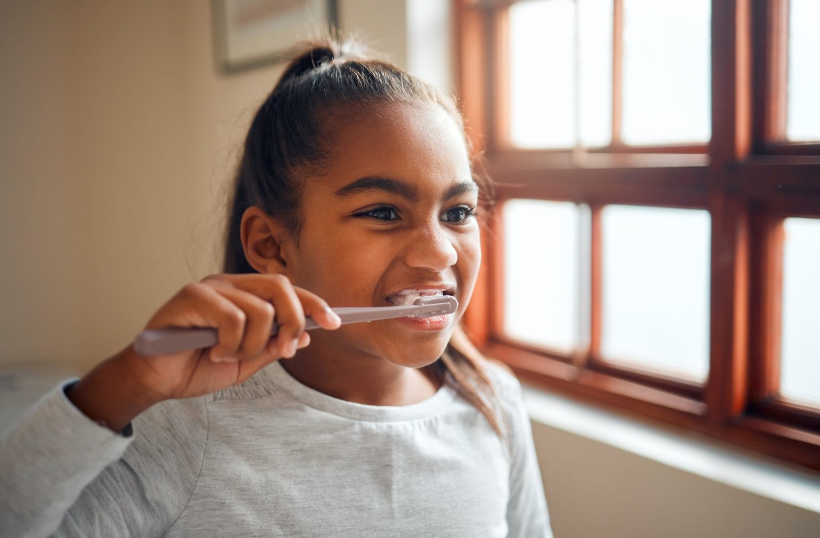 Girl brushing teeth, toothbrush for hygiene and clean mouth with fresh breath and dental health. Ch